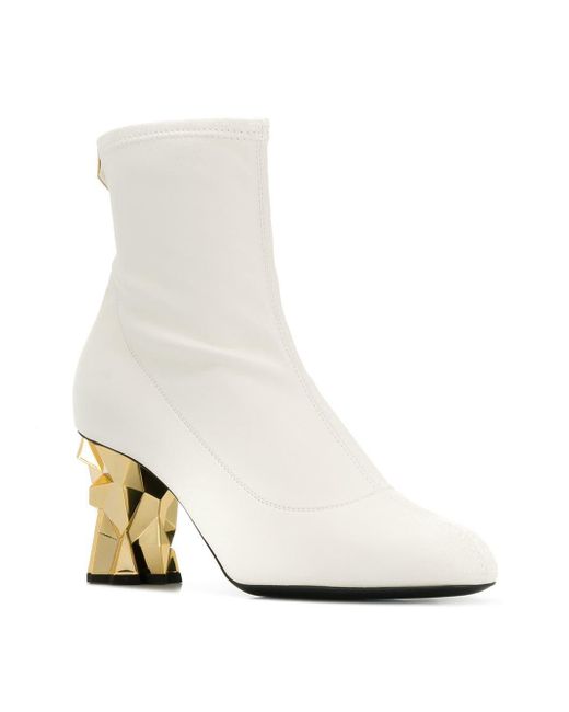 white boots gold heel