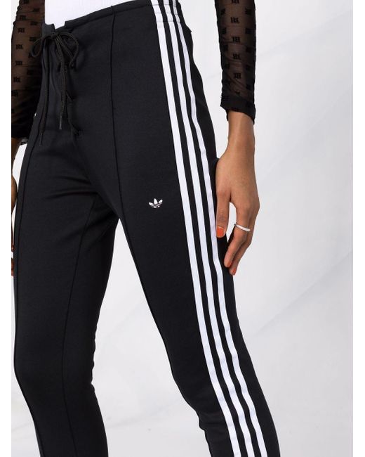 pantaloni adidas three stripes