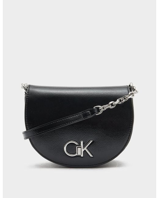 Calvin Klein Lock Saddle Bag in Black Lyst