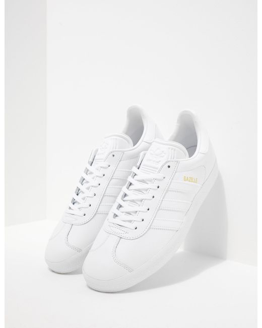 mens all white gazelles
