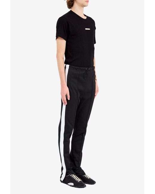 Maison Margiela Black Four Stitch Logo Skinny Track Pants for men