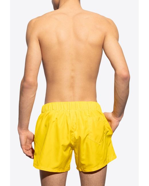 Moschino Yellow Rubberized Logo Swim Shorts for men