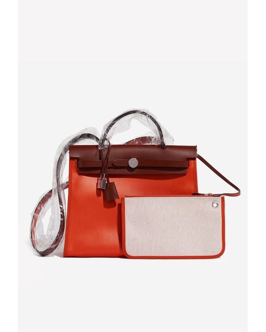 Hermès Red Herbag 31 In Orange Mècano And Ecru Toile And Rouge H Vache Hunter Leather With Palladium Hardware