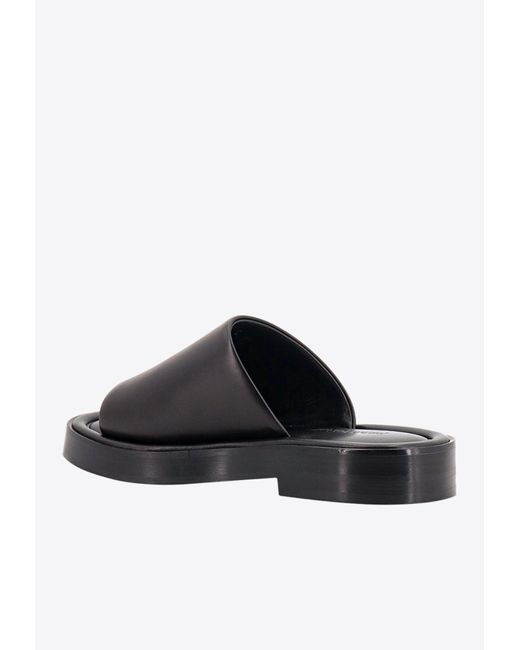 Ferragamo Black Logo Embossed Leather Slides for men