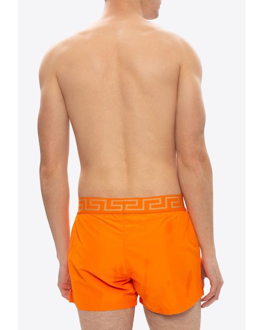 Versace Orange Greca Border Swim Shorts for men