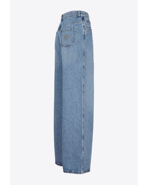 デニム・ジーパン MIUMIU WIDE LEG PANTS WITH EMBROIDERED LOGO Miu Miu logo-embroidered wide-leg Jeans | Blue | FARFETCH