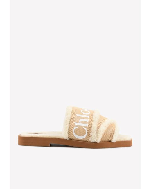 ChloÃ© Canvas Woody Shearling-trimmed Flat Sandals in Tan (Natural) | Lyst