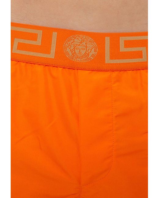 Versace Orange Greca Border Swim Shorts for men