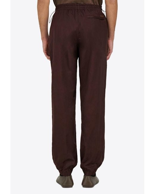 Ferragamo Brown Logo Patch Drawstring Track Pants for men
