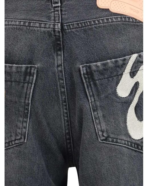 PDF Blue Jeans With Graphic Patches for men
