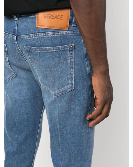 Jeans Slim Con Applicazione di Versace in Blue da Uomo