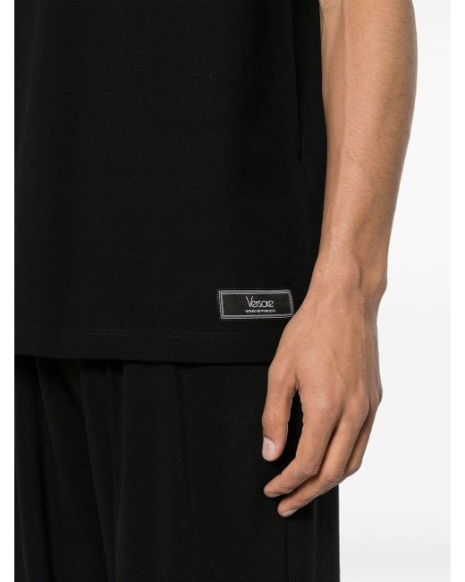 | Polo in cotone con logo e riga sul colletto | male | NERO | XL di Versace in Black da Uomo