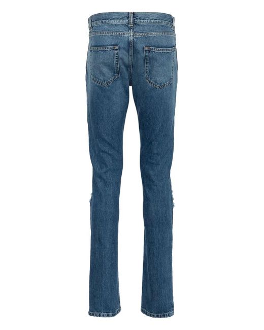 Saint Laurent Blue Ripped-Detail Slim-Fit Jeans for men