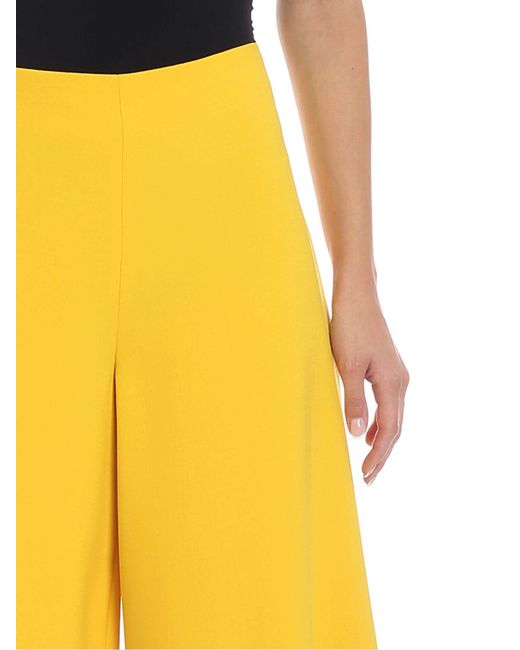 yellow cropped trousers