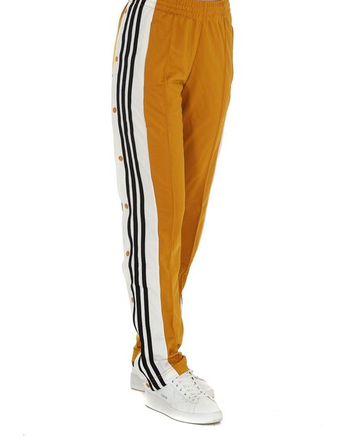 yellow nike tracksuit bottoms