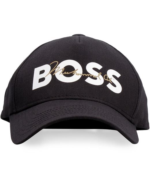 https://cdna.lystit.com/520/650/n/photos/thecorner/12f86a89/boss-by-hugo-boss-black-X-Muhammad-Ali-Logo-Baseball-Cap.jpeg