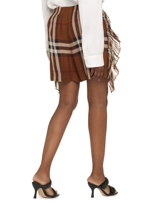 Shorts in motivo tartan di Burberry in Brown