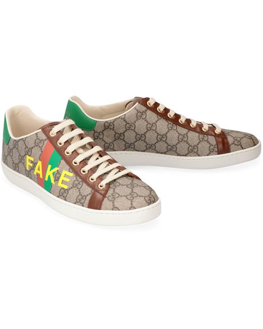 Sneakers Ace con stampa Fake-Not di Gucci in Natural