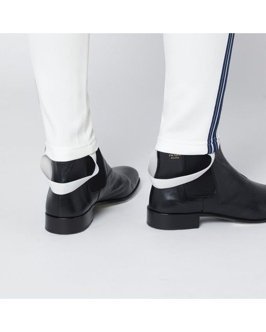 Leggings avorio in tessuto tecnico di Prada in White