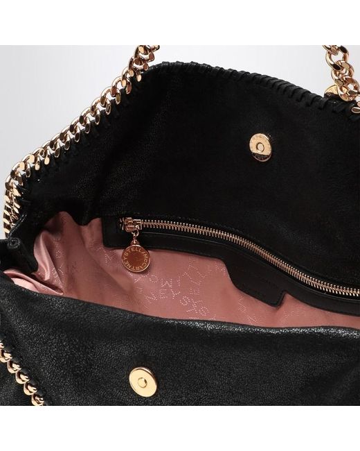 Borsa falabella fold over nera/oro di Stella McCartney in Black