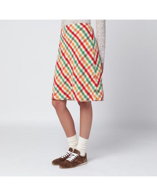 Gonna rossa/verde/soia in check e pile di Miu Miu in Orange