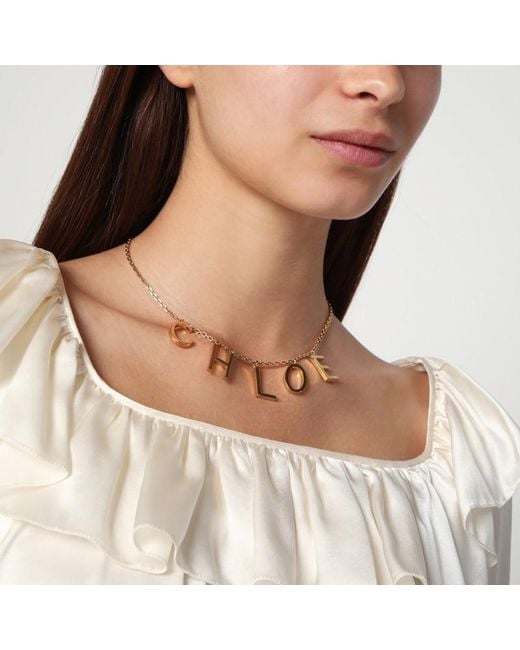 Collana letters in ottone vintage gold di Chloé in White