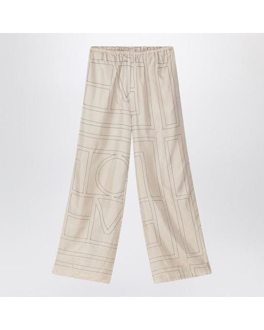 Totême  Natural Monogram Ivory Silk Trousers