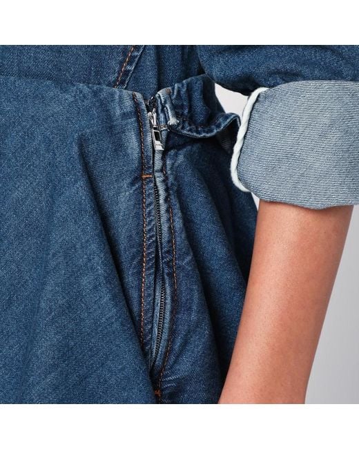 Gonna a spirale asimmetrica in denim di Alaïa in Blue