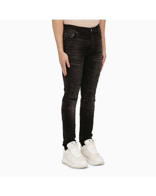 Jeans skinny distressed effetto slavato di Amiri in Black da Uomo