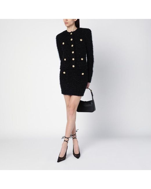 Minigonna nera in tweed con bottoni di Balmain in Black