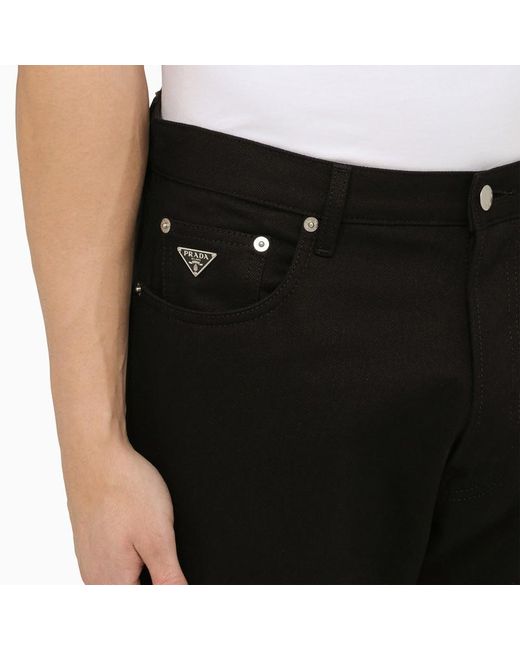 Jeans con triangolo logo in metallo di Prada in Black da Uomo