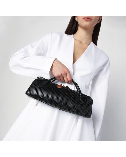 Pochette le teckel nera in pelle traforata di Alaïa in Black