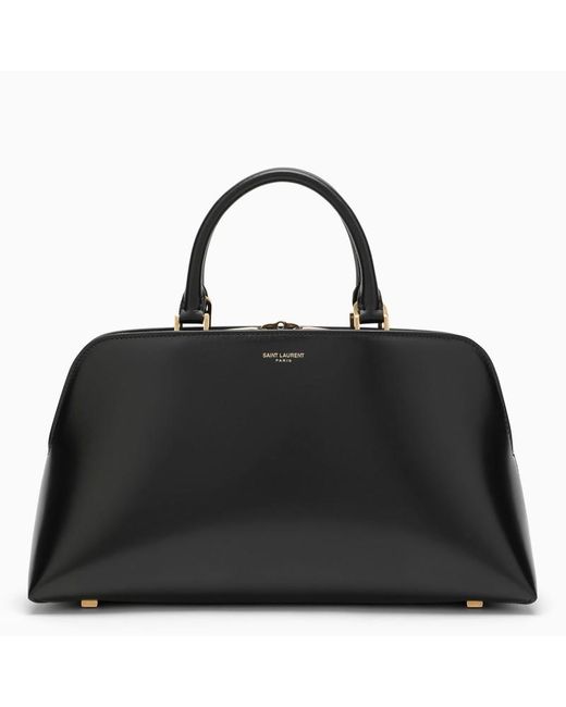 Borsa duffle bag sac de jour piccola nera in pelle lucida di Saint Laurent in Black