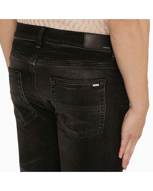 Jeans skinny distressed effetto slavato di Amiri in Black da Uomo