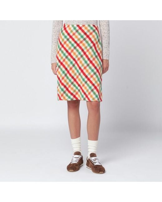 Gonna rossa/verde/soia in check e pile di Miu Miu in Orange