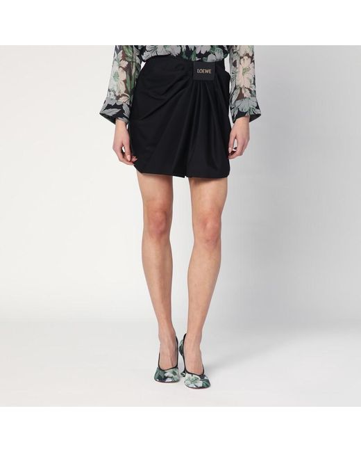 Mini gonna drappeggiata nera in cotone e seta di Loewe in Black