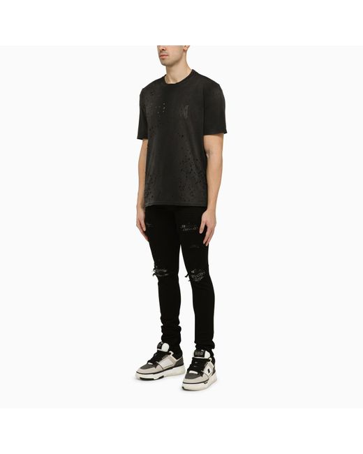 Amiri Black Skinny Jeans With Camouflage Patches for men