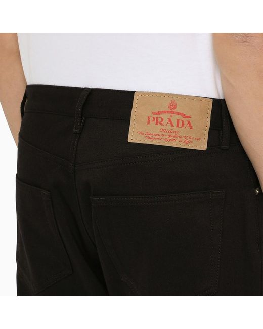 Jeans con triangolo logo in metallo di Prada in Black da Uomo