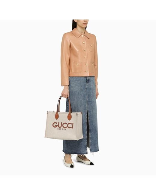 Borsa shopping in canvas con logo di Gucci in Natural