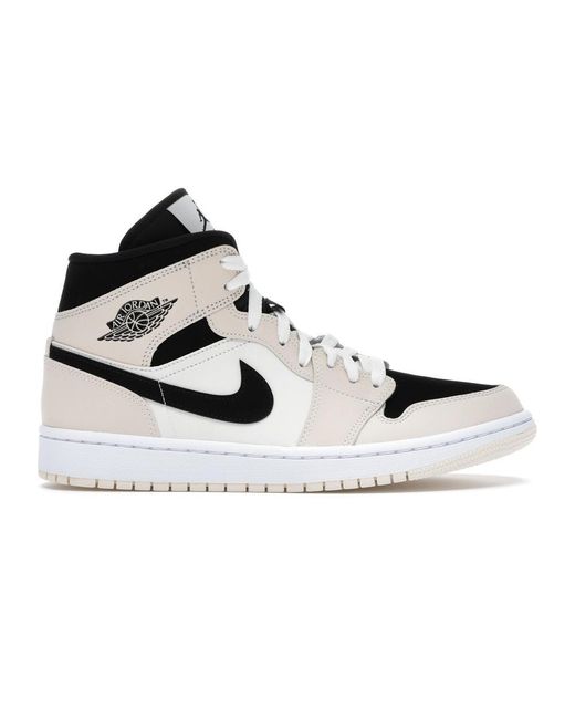 orange and black jordan 1 mid