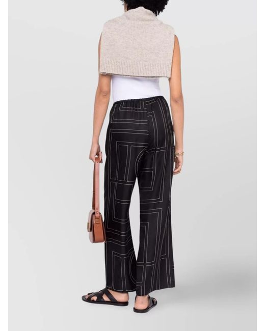 Totême Blue Silk Monogram Wide-Leg Pajama Trousers