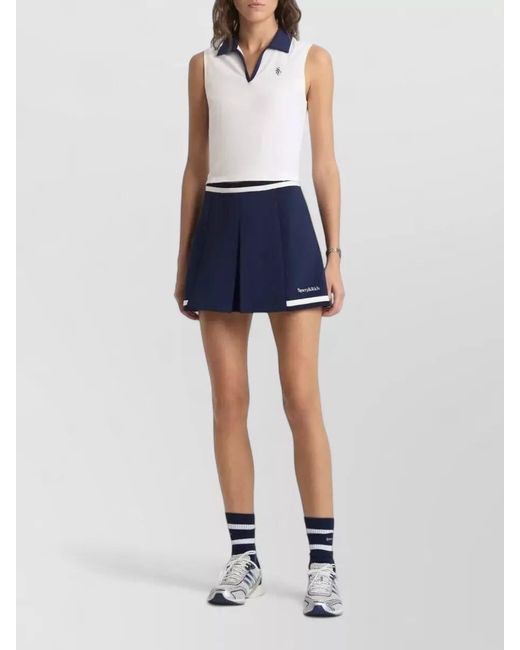 Sporty & Rich Blue Mila Serif Logo Pleated Mini Shorts