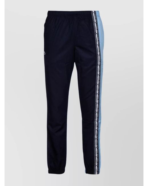 Lacoste Blue Trousers With Elastic Cuffs And Side Stripe for men
