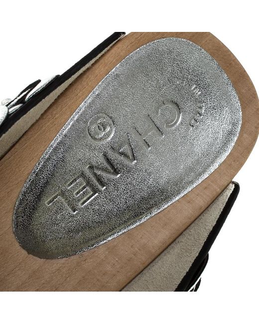 metallic silver clogs