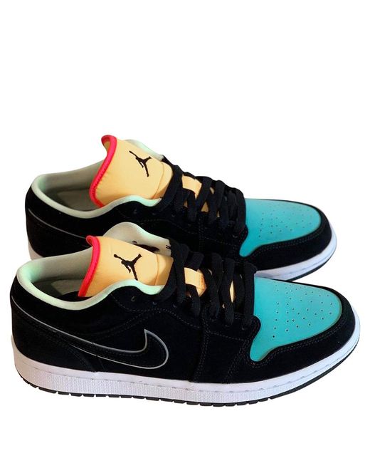 green and orange jordans