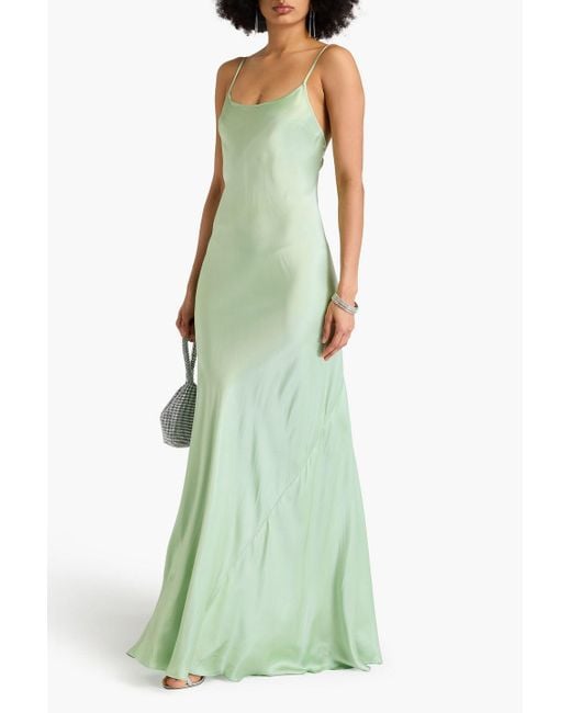 victoria beckham slip dress PSA: Beckham's White Is An Easy Summer Look Victoria Beckhams satin gown features an open twist back for shape Victoria Beckham Satin Maxi Slip