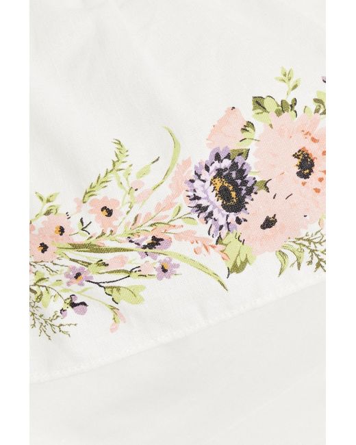 Mikael Aghal White Maxikleid aus einer baumwoll-leinenmischung mit blumenprint und asymmetrischer schulterpartie