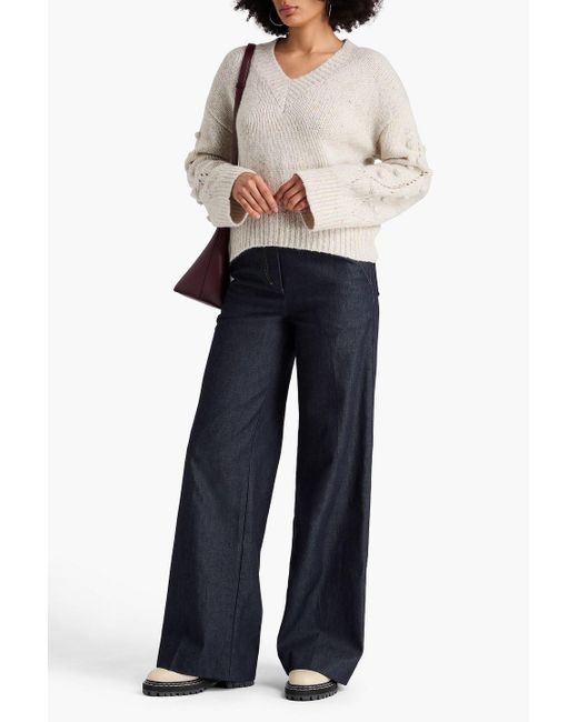 Autumn Cashmere White Melierter kaschmirpullover mit pomponverzierung