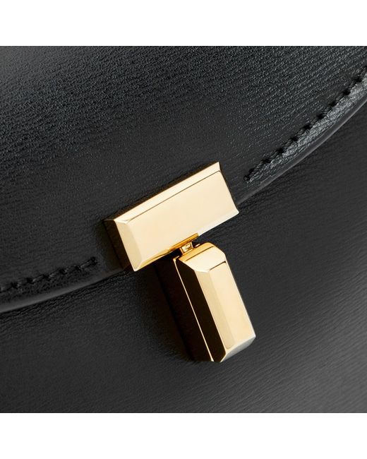 Totême Black T-Lock Leather Clutch Bag