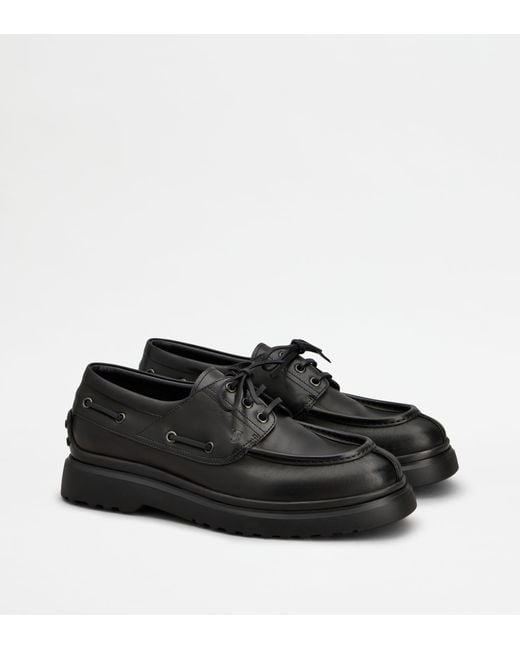 Tod's Black Boat Loafers for men